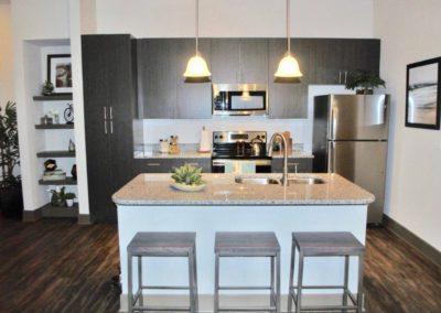 Kitchen with seating area at Addison at Tampa Oaks apartments for rent